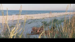 Amateur couple got caught having sex on the beach by voyeur.